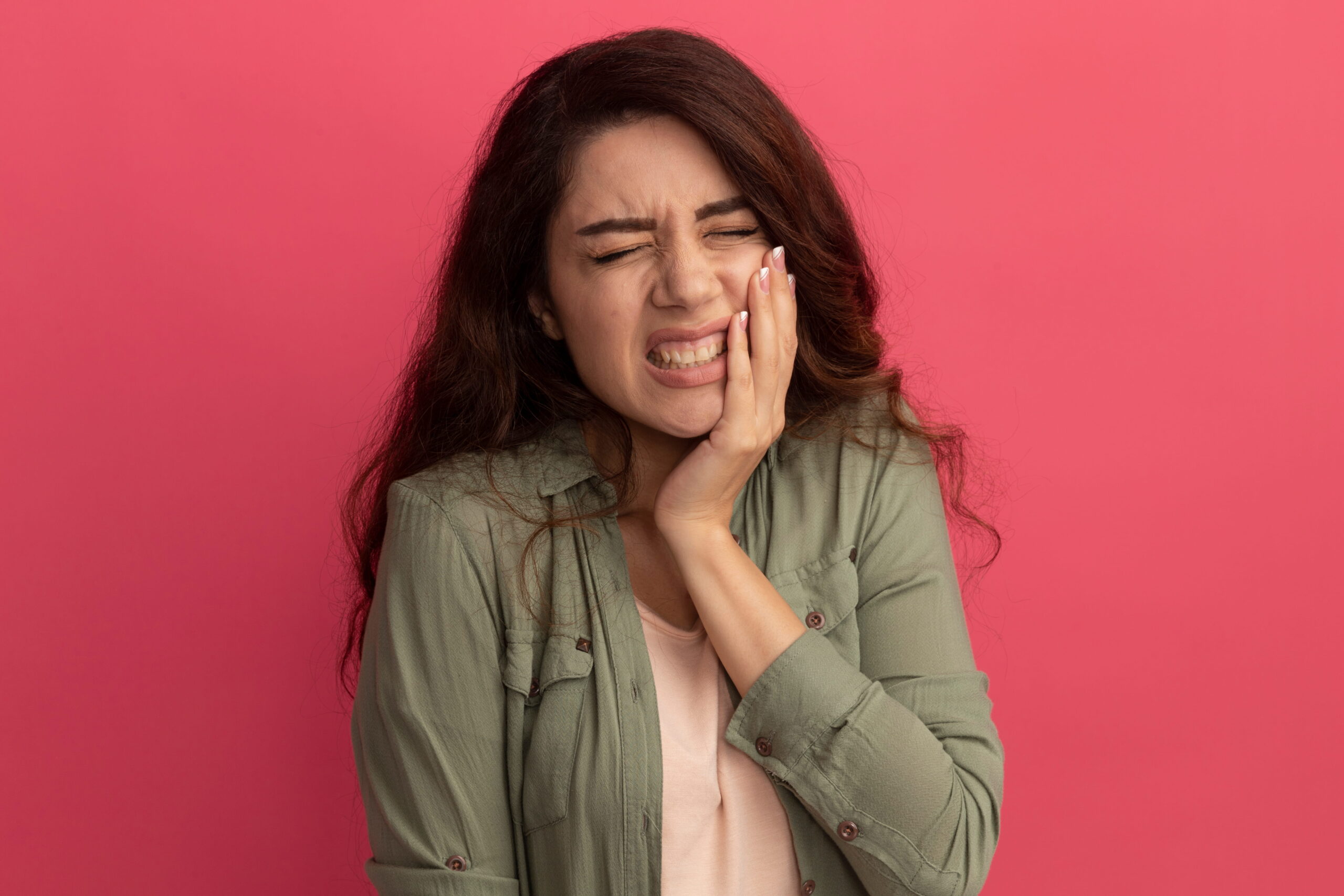 Woman experiencing tooth sensitivity — Calista Dental