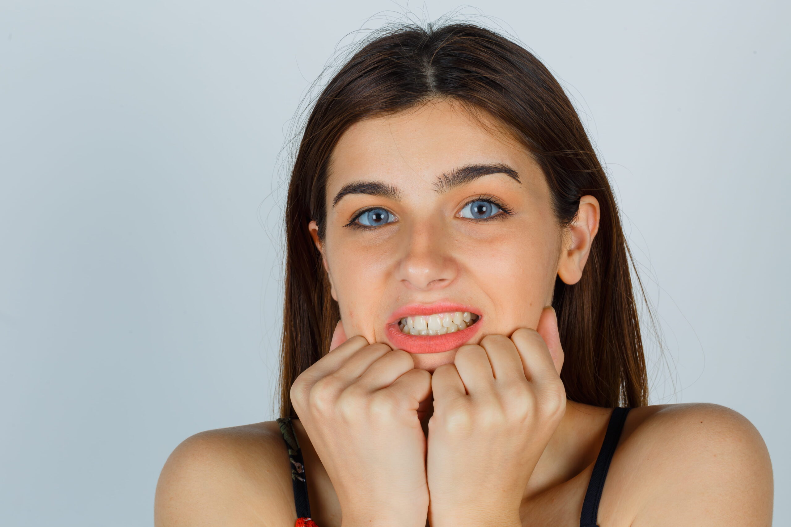 Woman clenching jaw — Teeth Grinding treatment at Calista Dental
